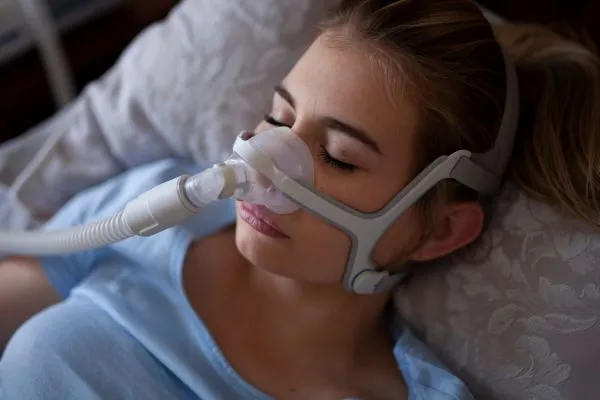 Woman suffering from sleep apnea